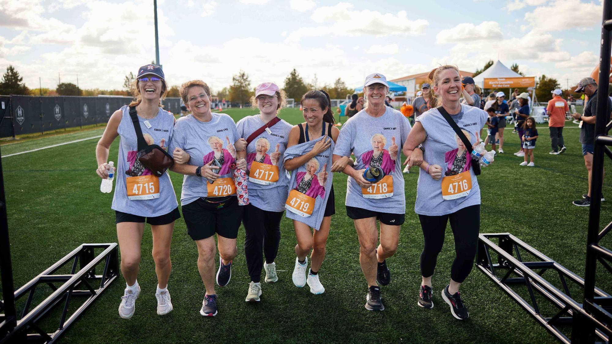 A group of run/walk participants in a park