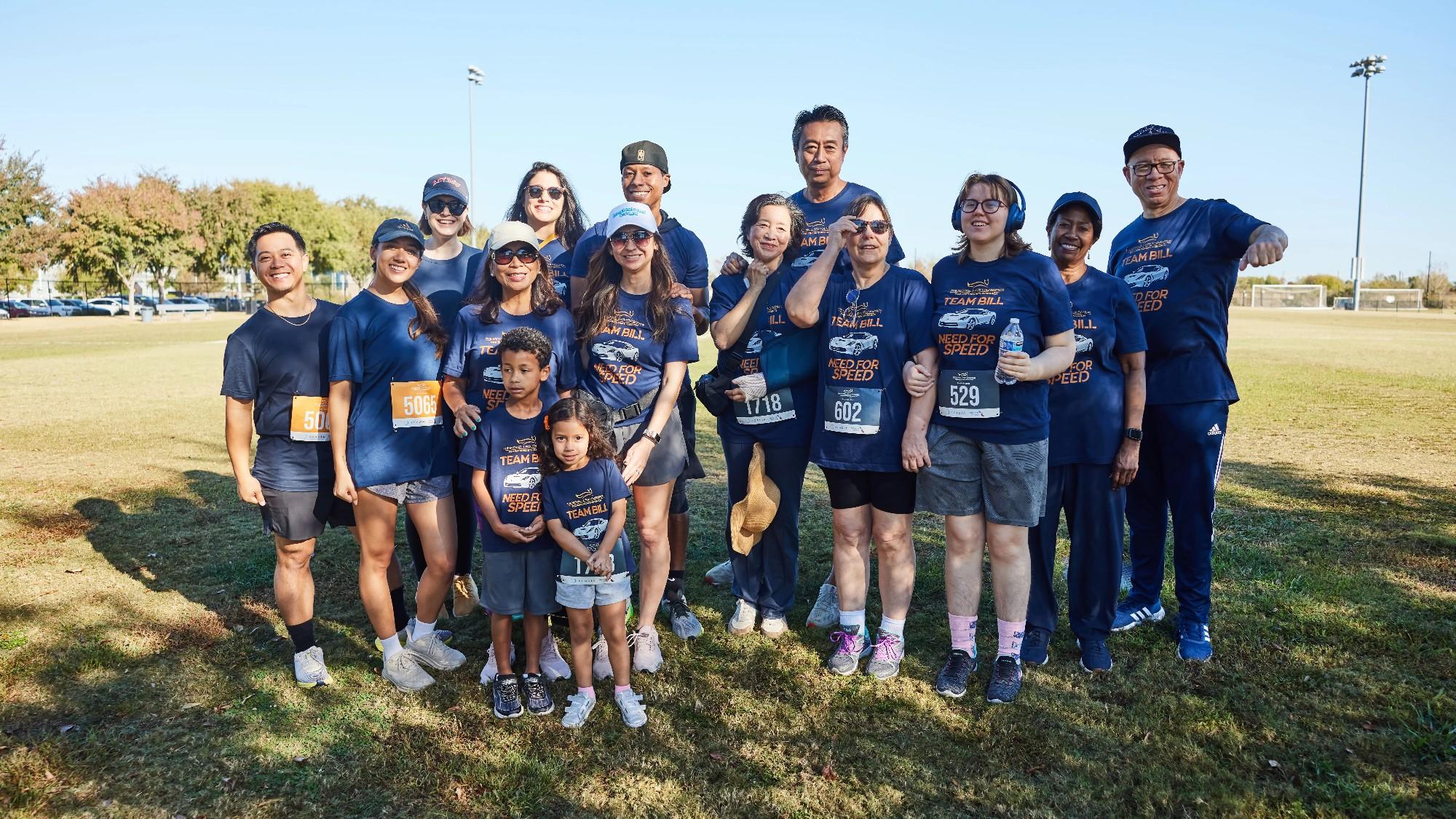 A group of run/walk participants in a park