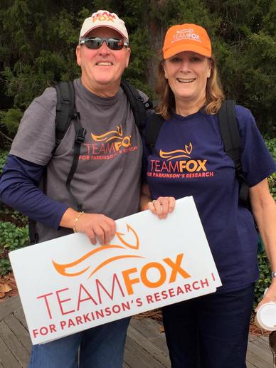Bob and Cecily holding a Team Fox sign