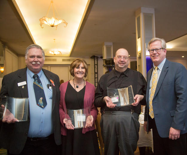 MJFF Senior Vice President of Public Policy, Ted Thompson, congratulates Kevin Mansfield, Leslie Peters and Charles Brown for their outstanding advocacy work (Year-Round Advocacy, Outstanding Advocacy and Social Media Advocacy, respectively) at the Policy Forum in Washington, D.C.