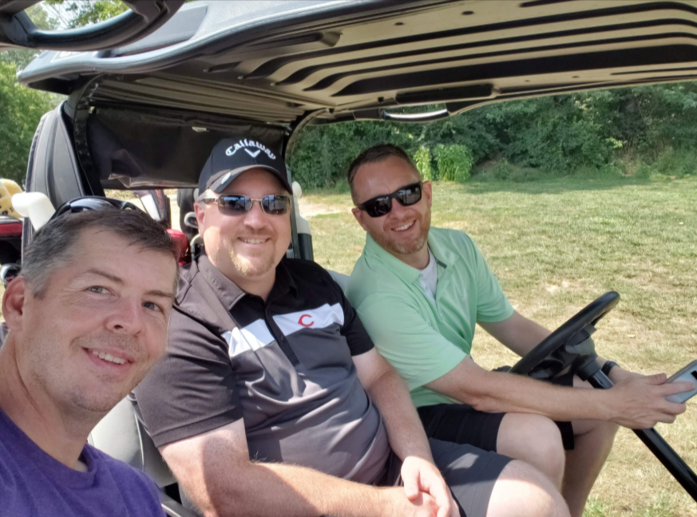 3 participants on the golf cart at breaking parkinson's in 2021