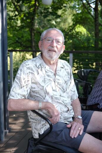 Gary Vallat sits outside