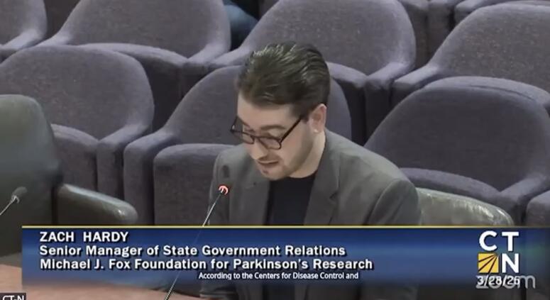 Zach Hardy testifies before Connecticut lawmakers in support of a proposed state fund for Parkinson’s research.