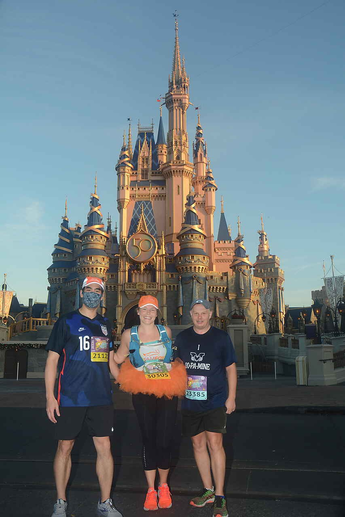 Colwell and friends in front of Disney castle