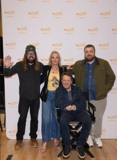 Comedians Dusty Slay, Maggie Hughes DePalo and Aaron Weber backstage with Michael J. Fox.