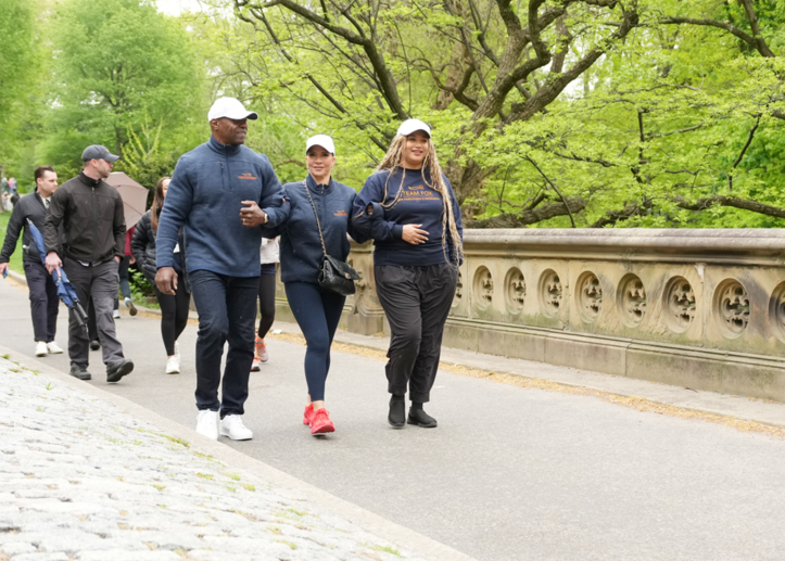 Rebecca Crews walks alongside her husband, Terry Crews, and daughter Azriel Crews. 