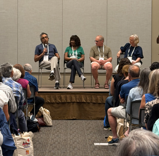 Community members participate in a panel presentation at WPC> 