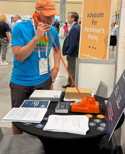 A man visits and interacts with the Foundation's booth at WPC.