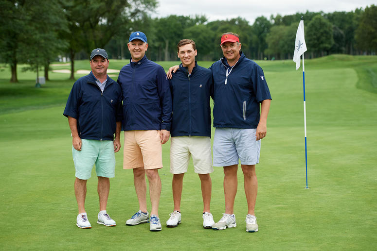Four Caucasian male golfers at MJFF's Breaking Par fundraiser.