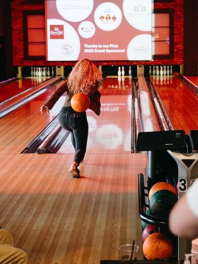 A woman bowling