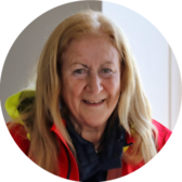 woman smiling in a red jacket