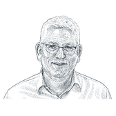Man in glasses and light, button up shirt