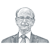 Man wearing glasses, a dark jacket and a tie