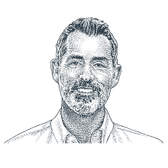 Man smiling with white, collared shirt