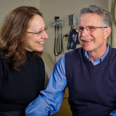 Two people smiling