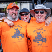 Group of three laughing at the camera