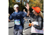 Gary gets a high five from Susie as he passes the Team Fox cheer zone at the 2018 New York City Marathon.