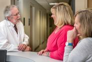 Doctor speaking to patients