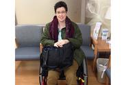 Woman sitting in wheelchair at doctor's office