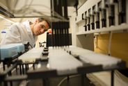 Lab tech performs research in a lab