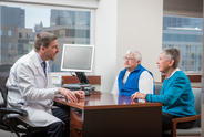 Doctor and two people in office