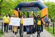 A group celebrates at the finish line of the 2026 Parkinson's Unity Walk.
