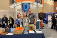 MJFF staff stand in front of the Foundation's booth at WPC.