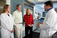 Researchers talking with patients