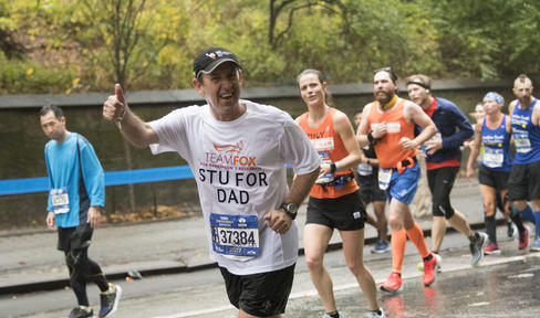 All smiles from Team Fox during a rainy 2018 New York City Marathon.