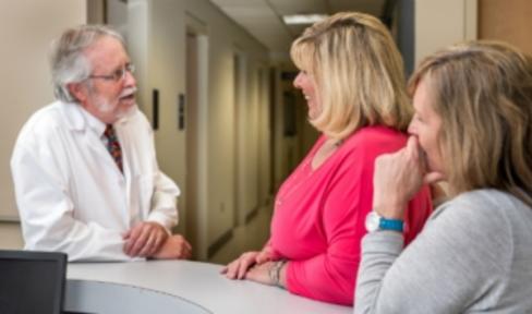 Doctor speaking to patients