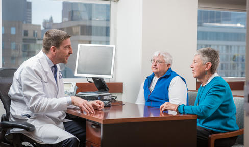 Doctor and two people in office