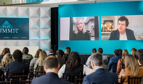 Michael and Debi on screen at the STAT summit
