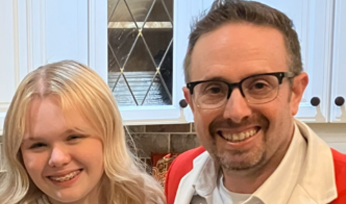 Bryan Roberts in a Santa "suit" with his daughter, Avery. 