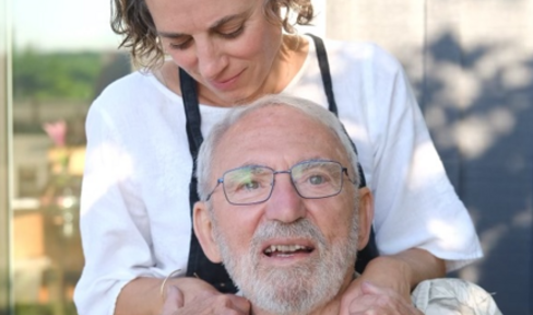 Aimie Vallat with her arms around her father, Gary Vallat.