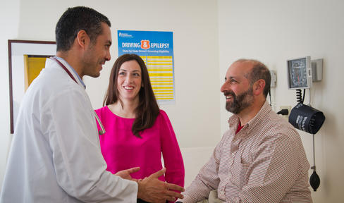 Doctor and two people in clinic room