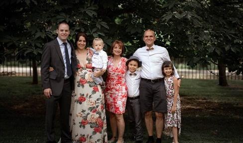 People in formal attire smiling at camera