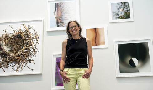 Torrance York posing with her work