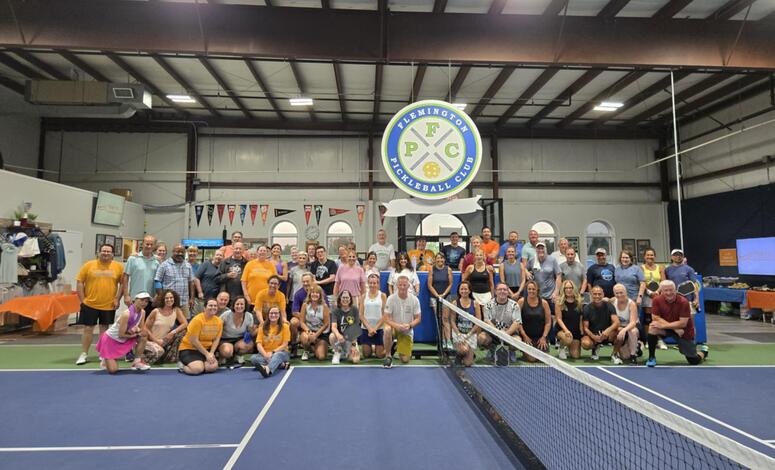 Group photo of the Pickleball event.