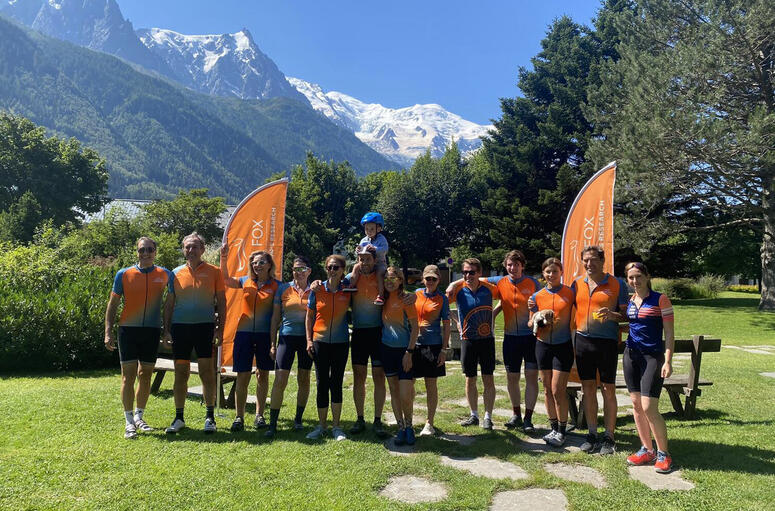A group of cyclists for Team Fox pose in front of the French Alps in Chamonix.