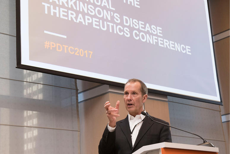 Male speaker at podium for the 2017 Parkinson's Disease Therapeutics Conference