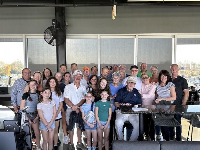 A group of people at a Targeting A Cure Top Golf Event