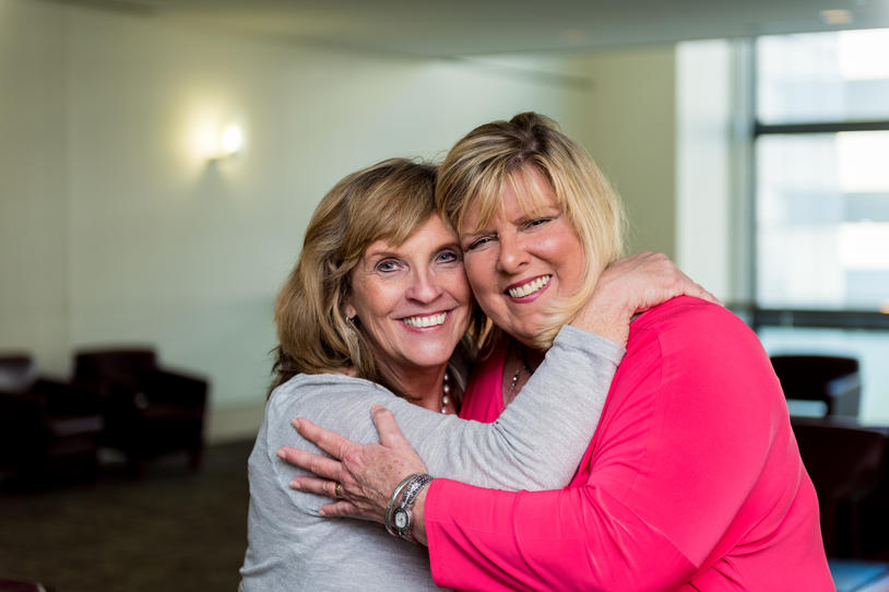 Two friends embracing.