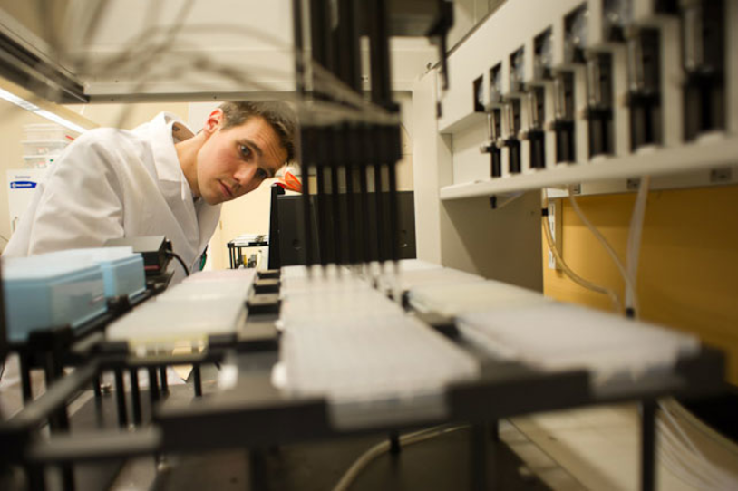 Lab tech performs research in a lab