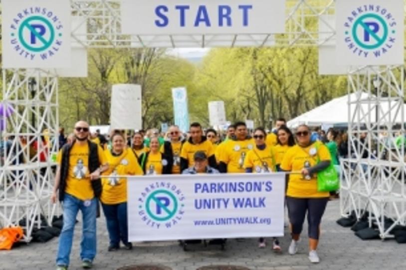 Supporters holding banner at the start of the Parkinson's Unity Walk 