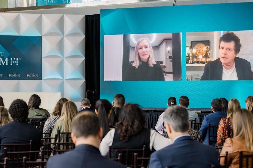 Michael and Debi on screen at the STAT summit