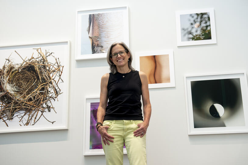 Torrance York posing with her work