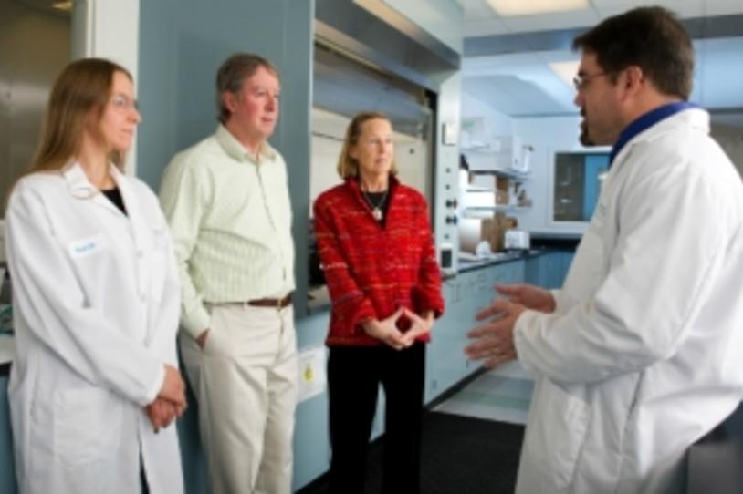 Researchers talking with patients