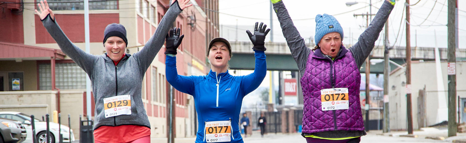 Three females running at a Fox Trot.