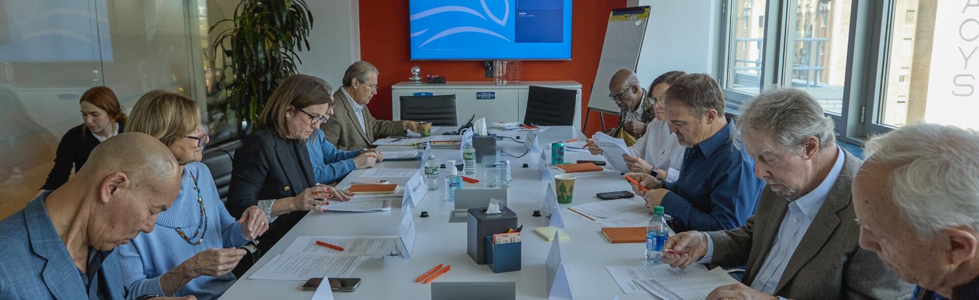 Group of patients reviewing documents in office