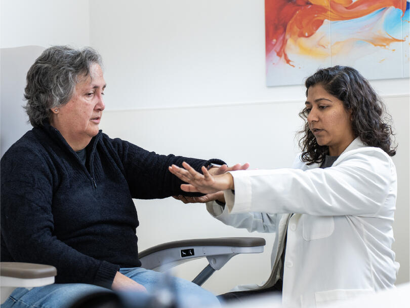 A physician performing an examination with a patient